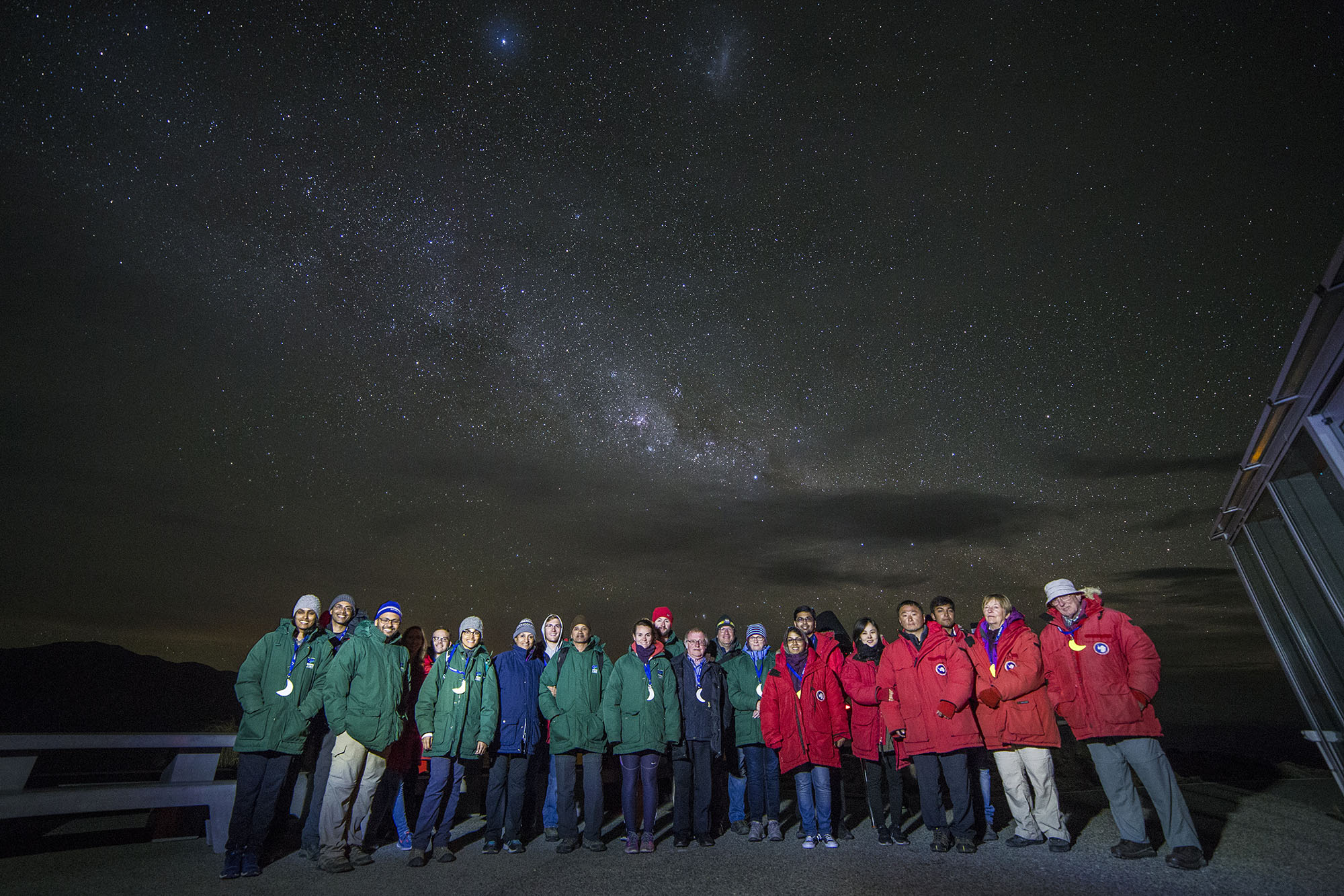 At the Mt. John Observatory. Me in the center with the headlamp. Southern Cross and Magellanic Clouds overhead. 