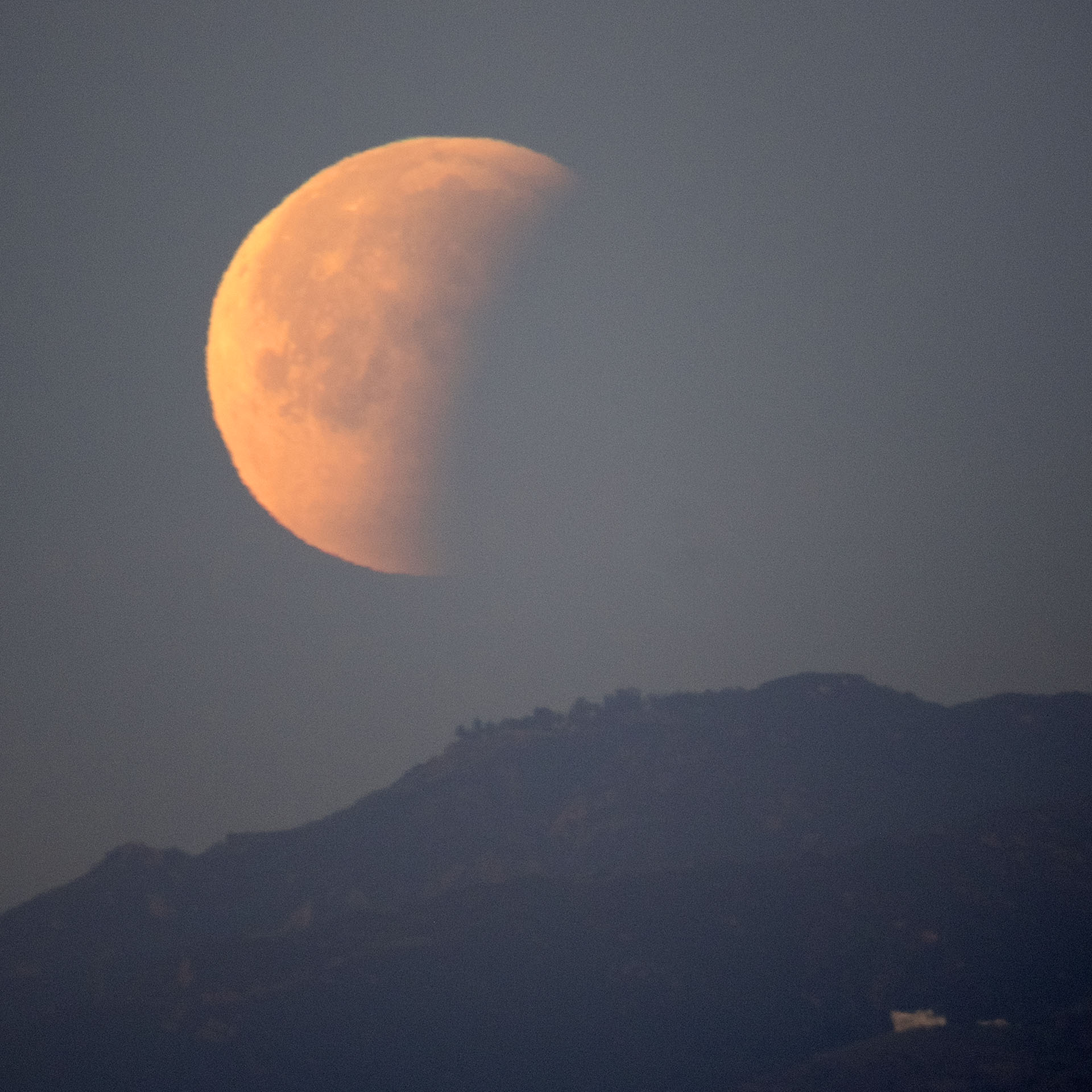 Eclipse 6: Moonset. The partially-eclipsed moon sinks behind the Santa Monica Mountains